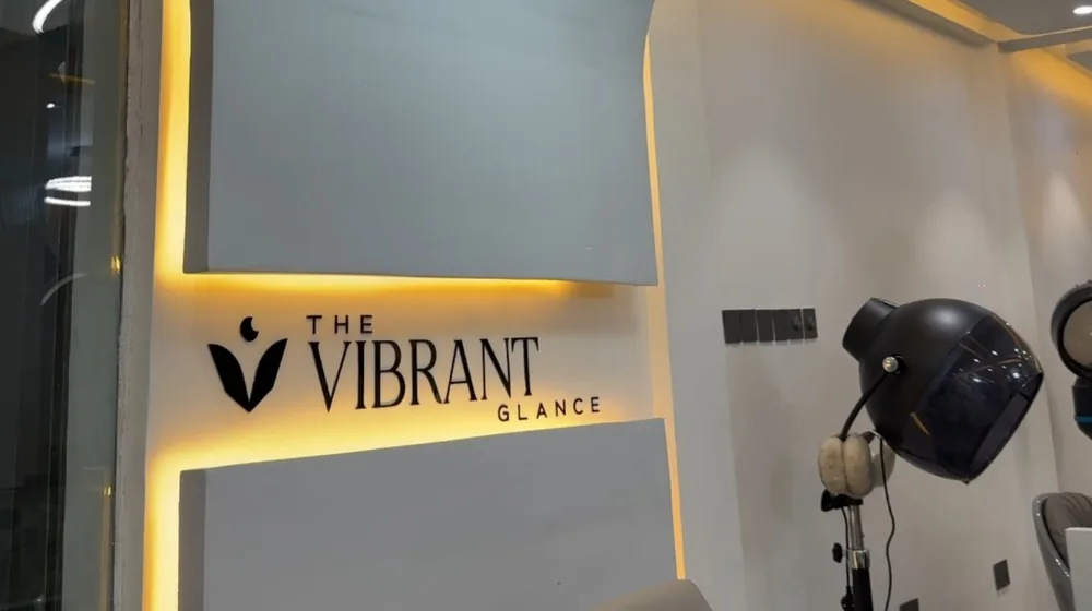The Vibrant Glance branded reception wall